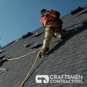 worker installing roof